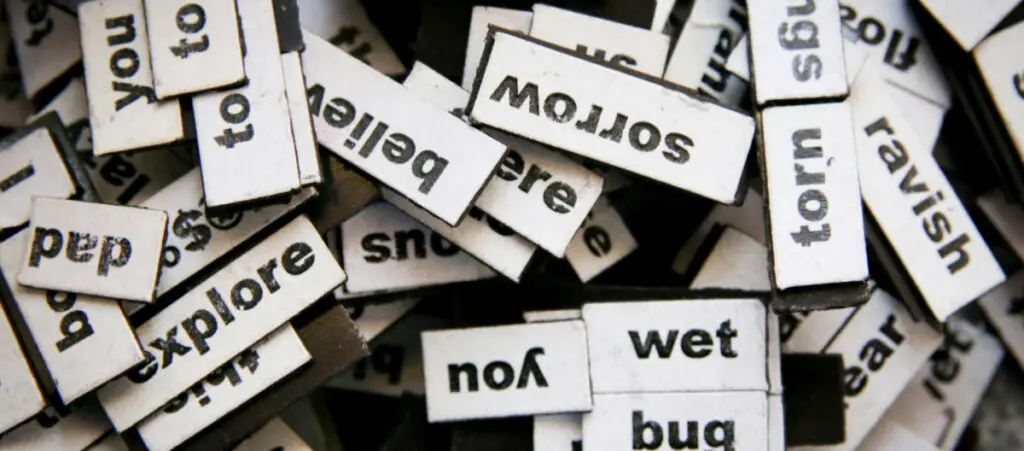 several cutouts of words on top of each other