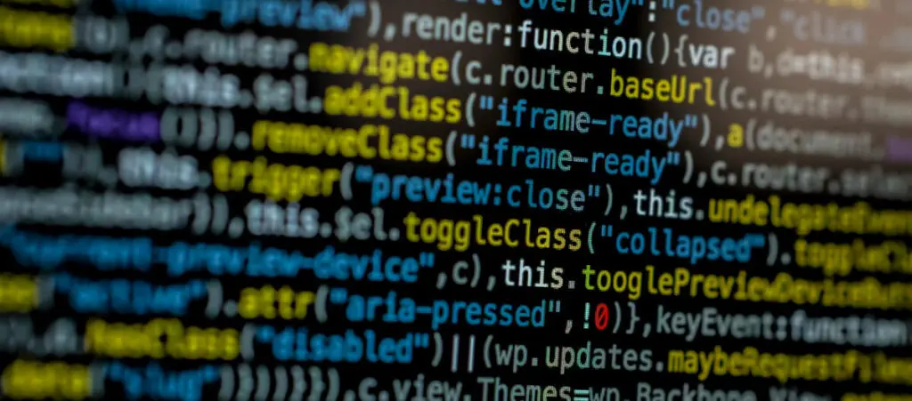 colorful programming code over a dark screen