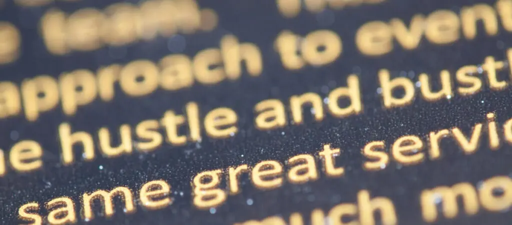 close up of yellow text over a black background