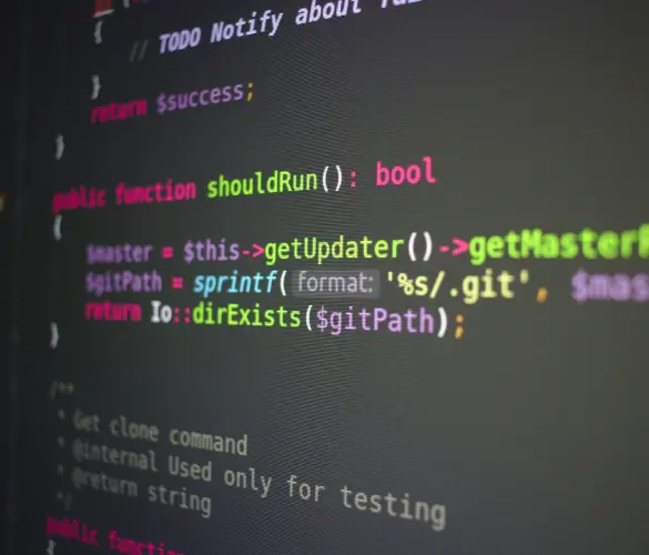 colorful PHP programming code on a dark gray computer screen background