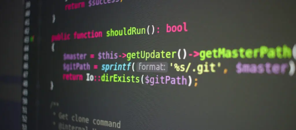 colorful PHP programming code on a dark gray computer screen background