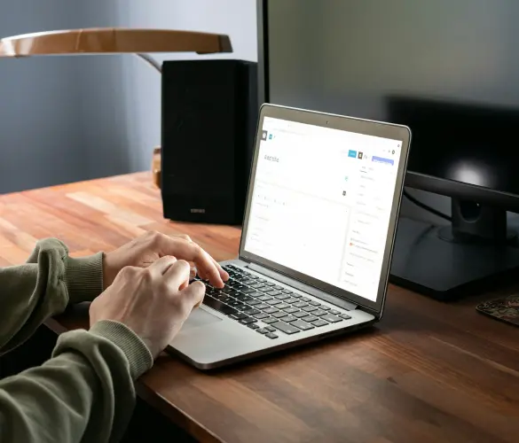 over the shoulder view of someone using a Mac to edit a page or post using WordPress's Gutenberg editor