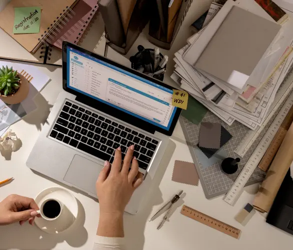 overhead view of someone working on a laptop