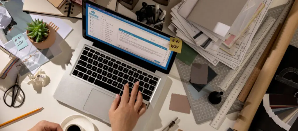 overhead view of someone working on a laptop