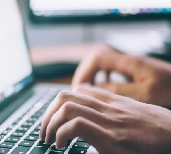 closeup of someone using a laptop keyboard