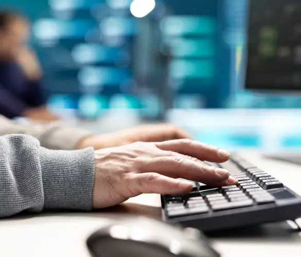 a closeup of someone using a keyboard at work