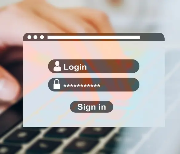 a hand typing on a computer keyboard with a login form overlayed on top